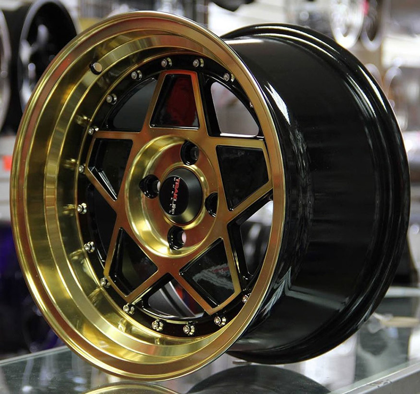 TRAKLITE F- FORTY 15X8.25 4X100 ET20 GLOSS BLACK ACCENTS / ANODIZED GOLD LIP